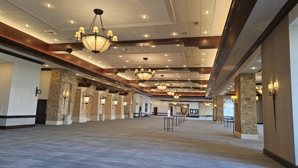 a large room with lights and columns