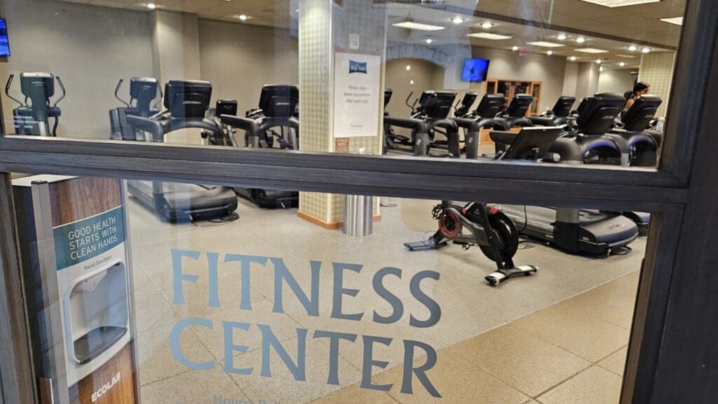 a room with exercise bikes and treadmills