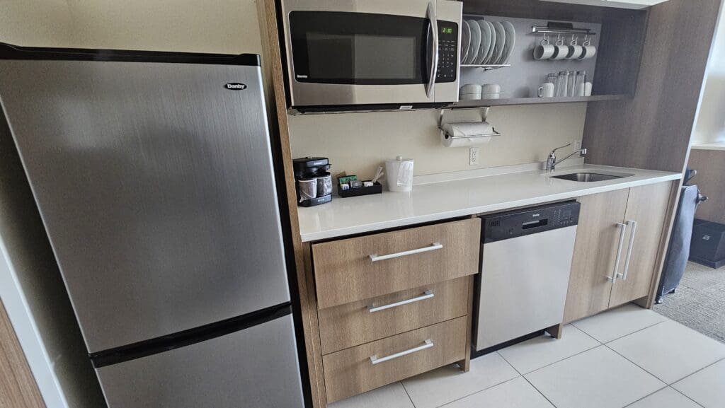 a kitchen with a microwave and dishwasher