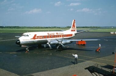 a man standing next to an airplane