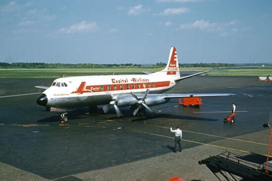 a man standing next to an airplane