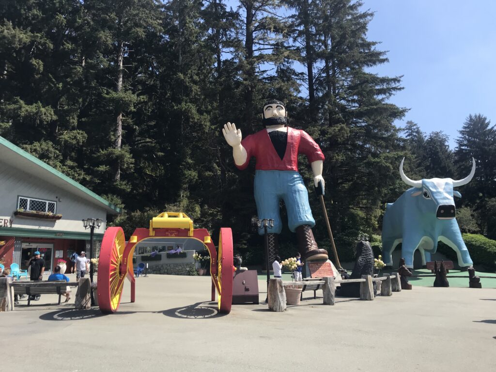 a large statue of a man with a bull and a cart