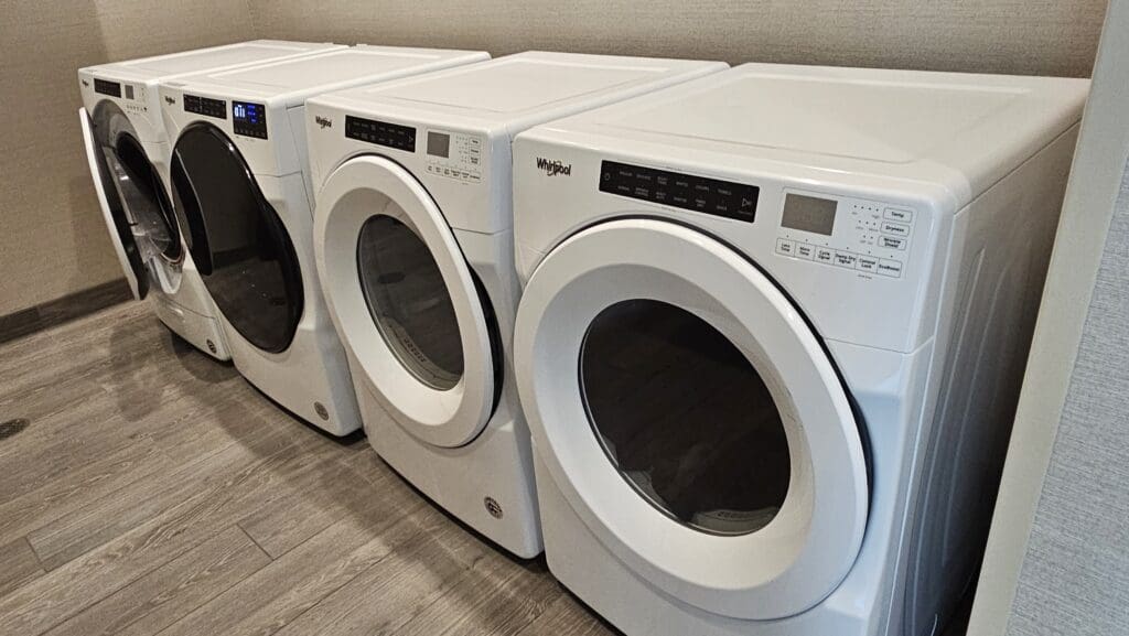 a row of white washing machines