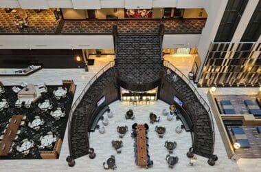 a high angle view of a building with a staircase and tables
