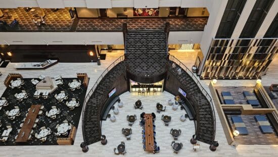 a high angle view of a building with a staircase and tables