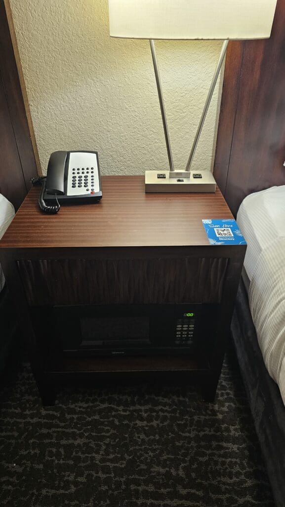 a telephone and microwave on a table