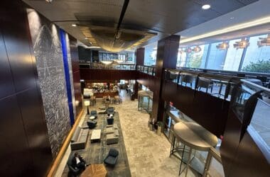 a high angle view of a building with a couple of people sitting on a table