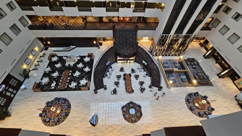 a high angle view of a large room with tables and chairs