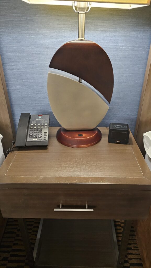 a telephone and a sculpture on a table