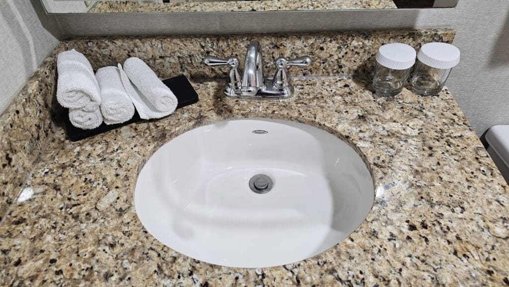 a sink with a marble counter top