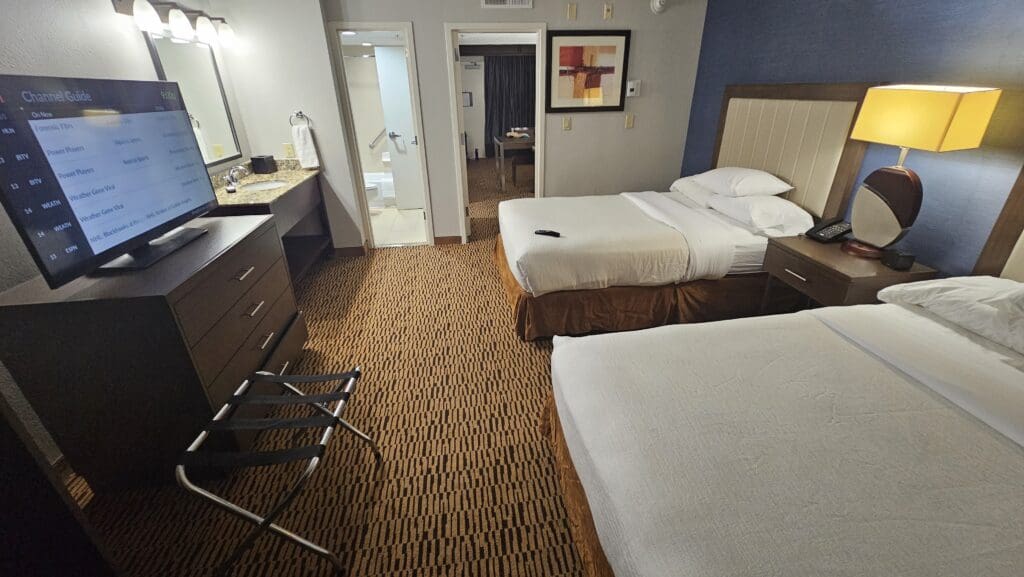 a hotel room with two beds