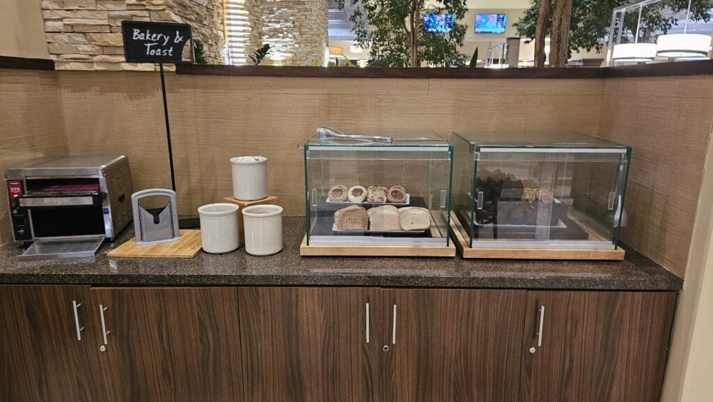 bread in a glass case on a counter