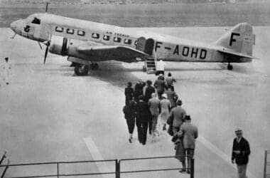 a group of people walking towards an airplane