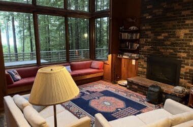 a living room with a fireplace and couches