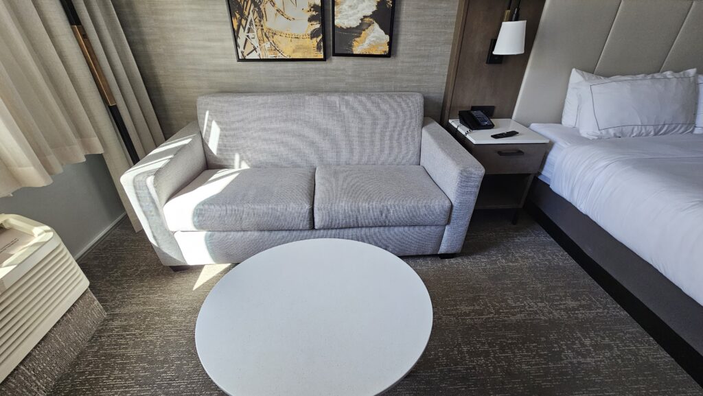 a couch and a table in a hotel room