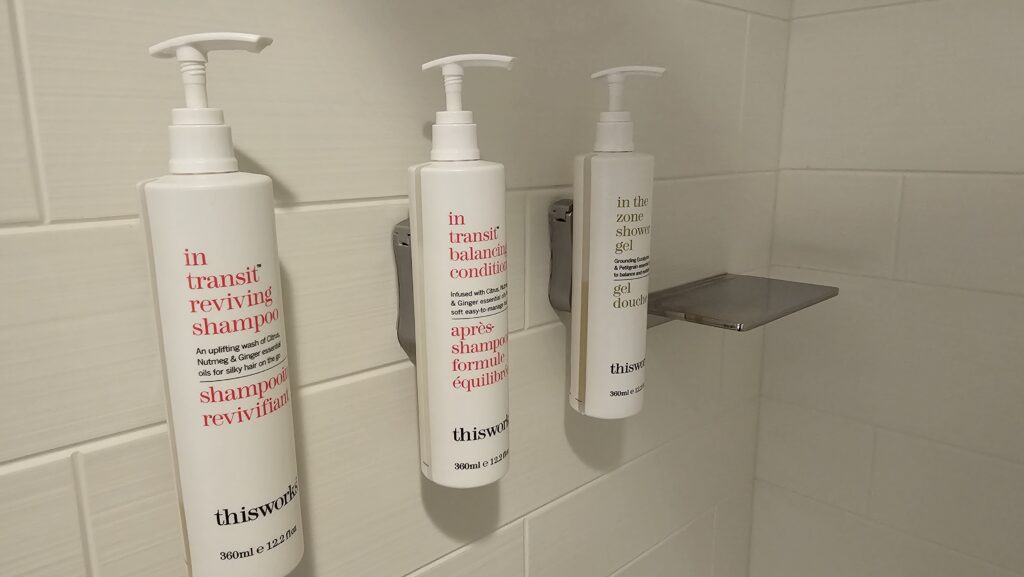 a group of shampoo bottles on a wall