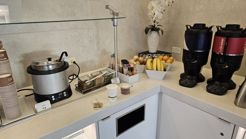 a kitchen counter with a blender and fruits