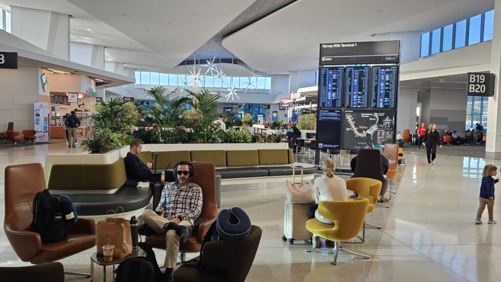 people sitting in chairs in a terminal