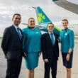 a group of people standing in front of an airplane