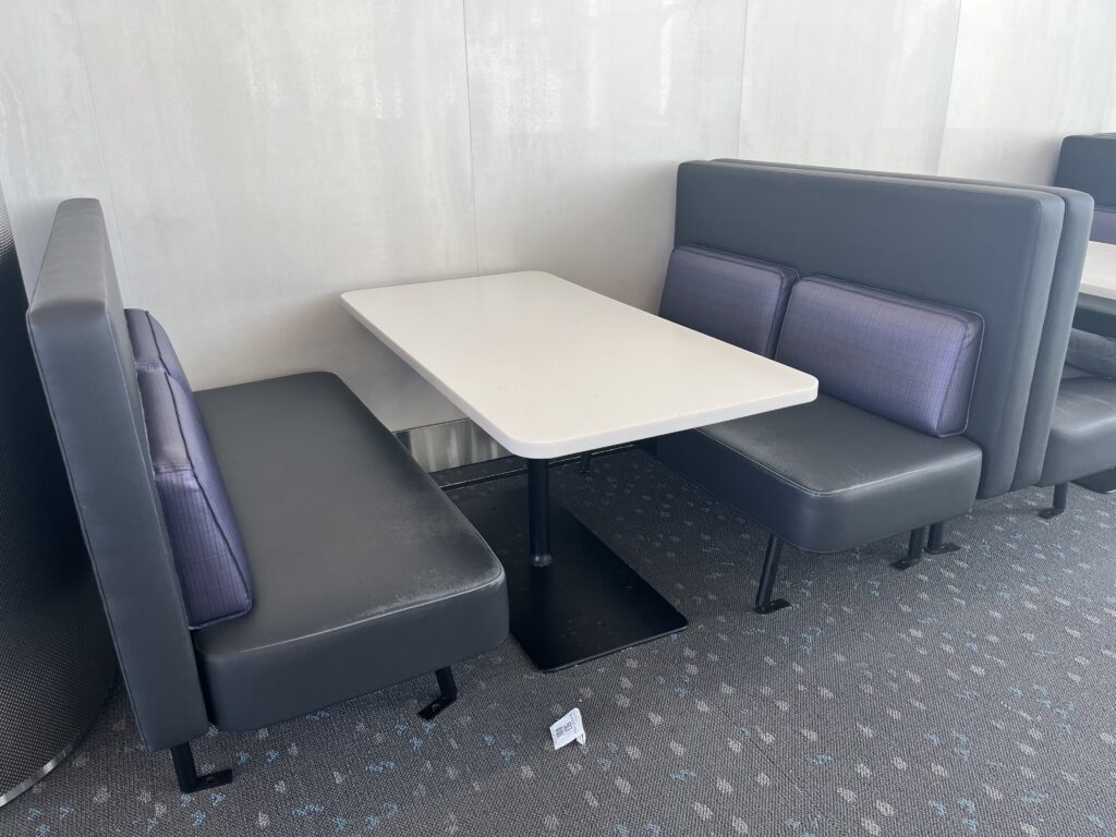 a white table and black booth seats