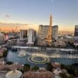 a city with a fountain and a tower