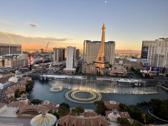 a city with a fountain and a tower