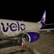 a plane on the runway at night