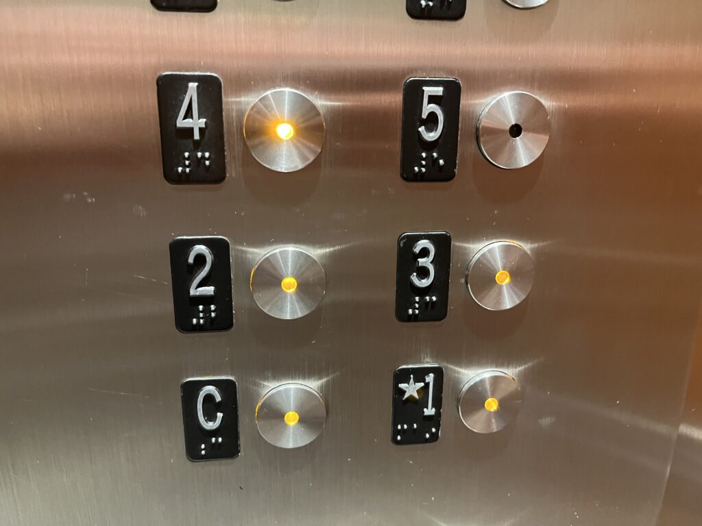 a close up of elevator buttons