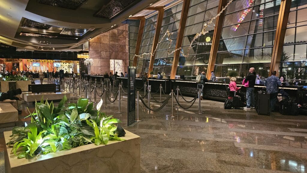 a line of rope barriers in a hotel lobby