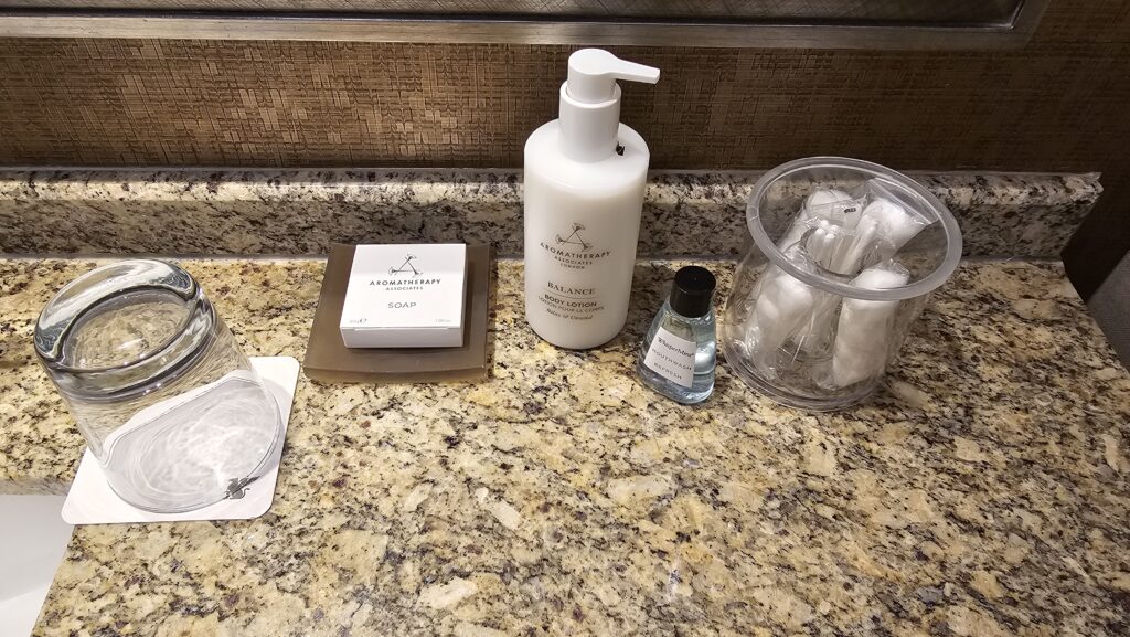 a bathroom counter with soap and other items