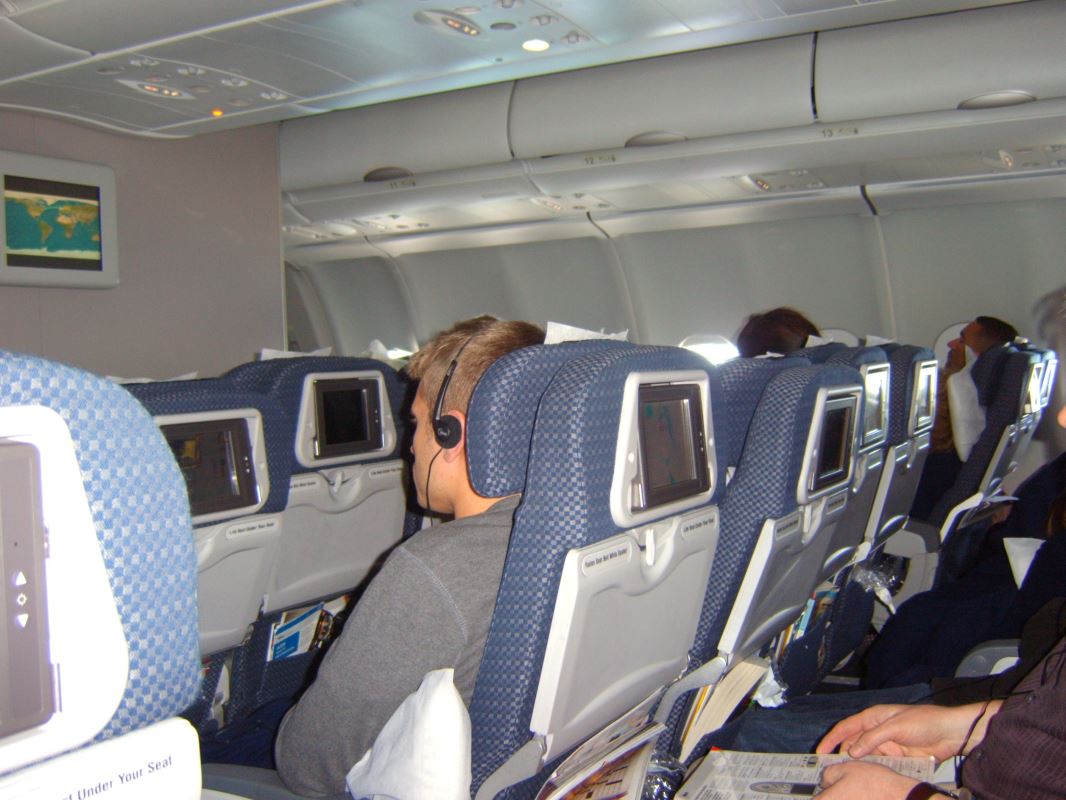 a group of people sitting in an airplane