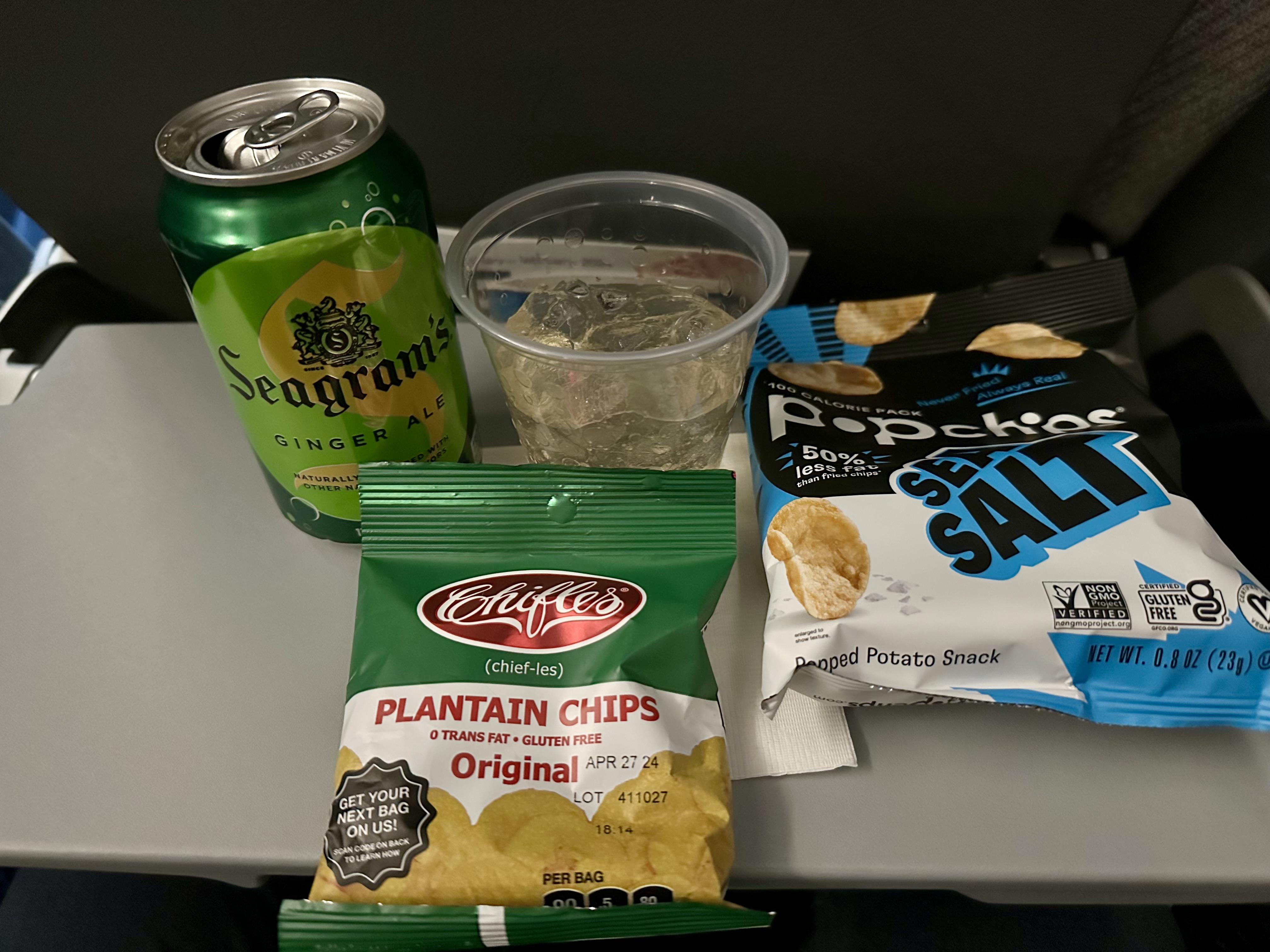 a group of chips and a drink on a table