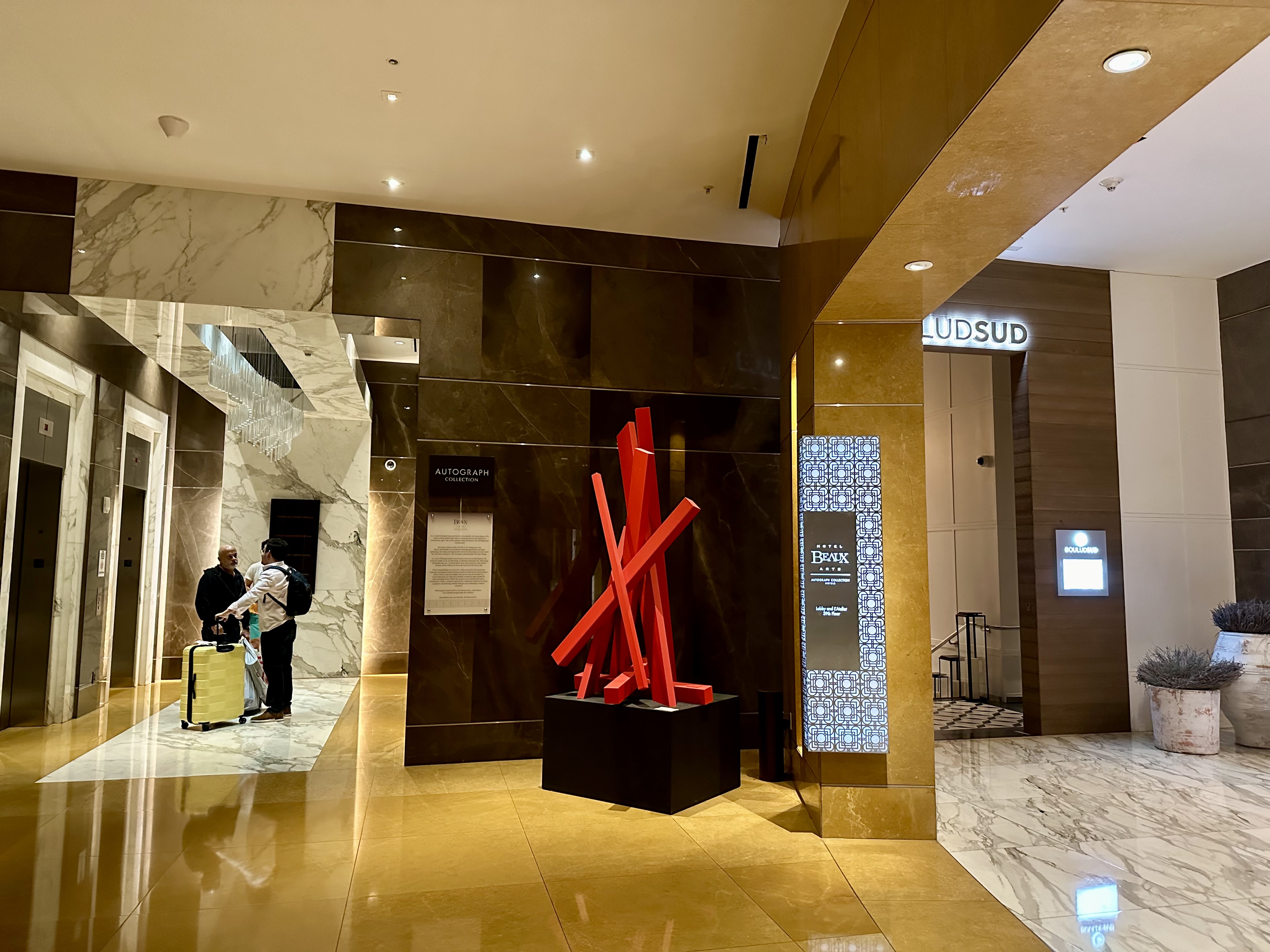 a red sculpture in a lobby