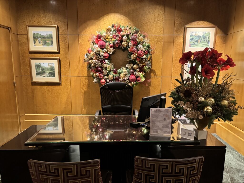 a desk with a wreath on the wall