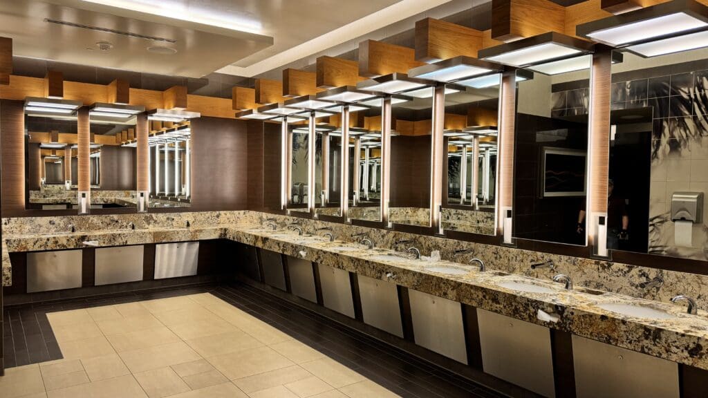 a bathroom with sinks and mirrors