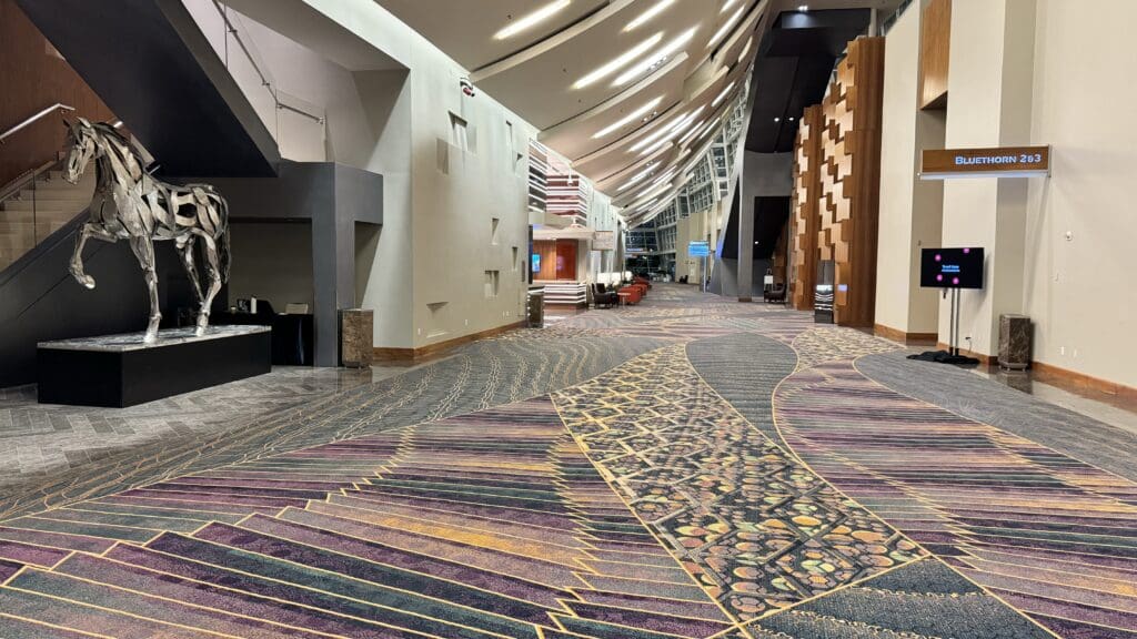 a large hall with a patterned carpet