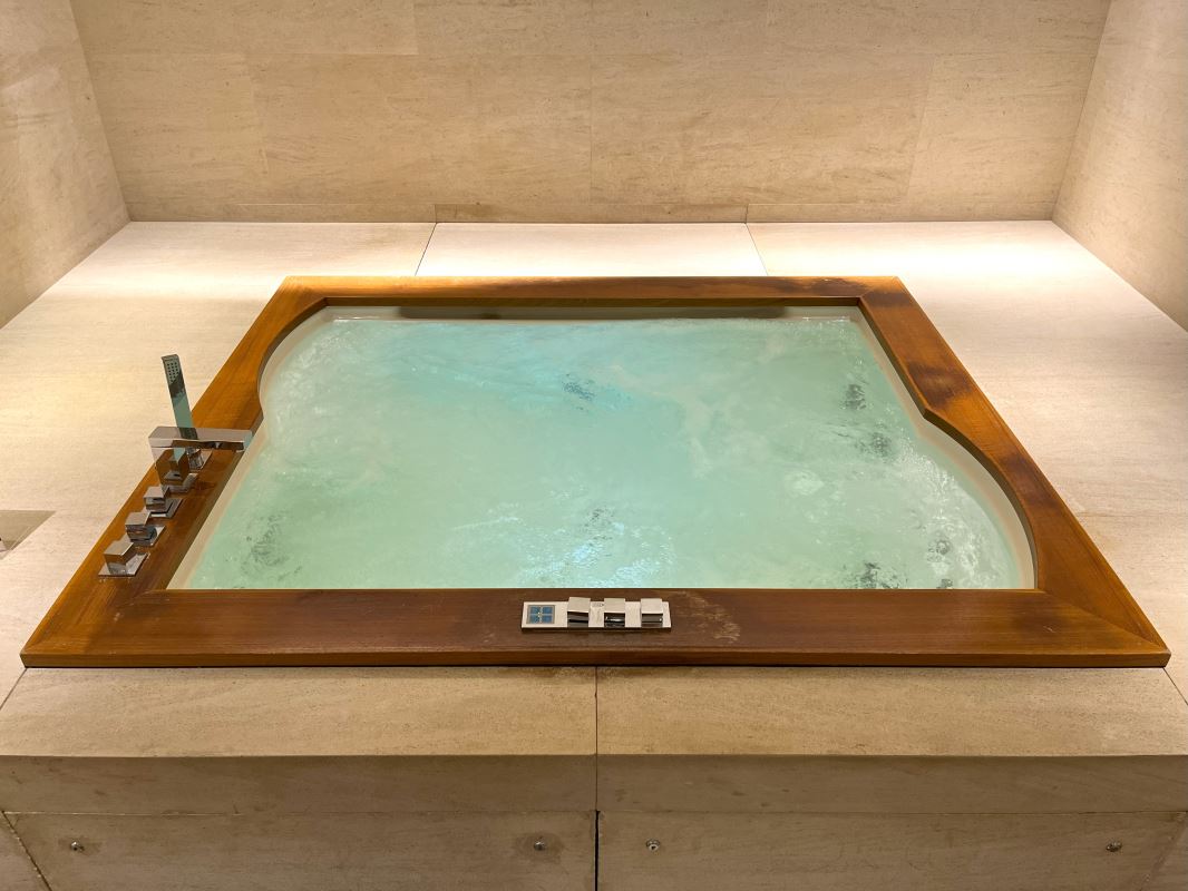 a wooden square tub with water in it
