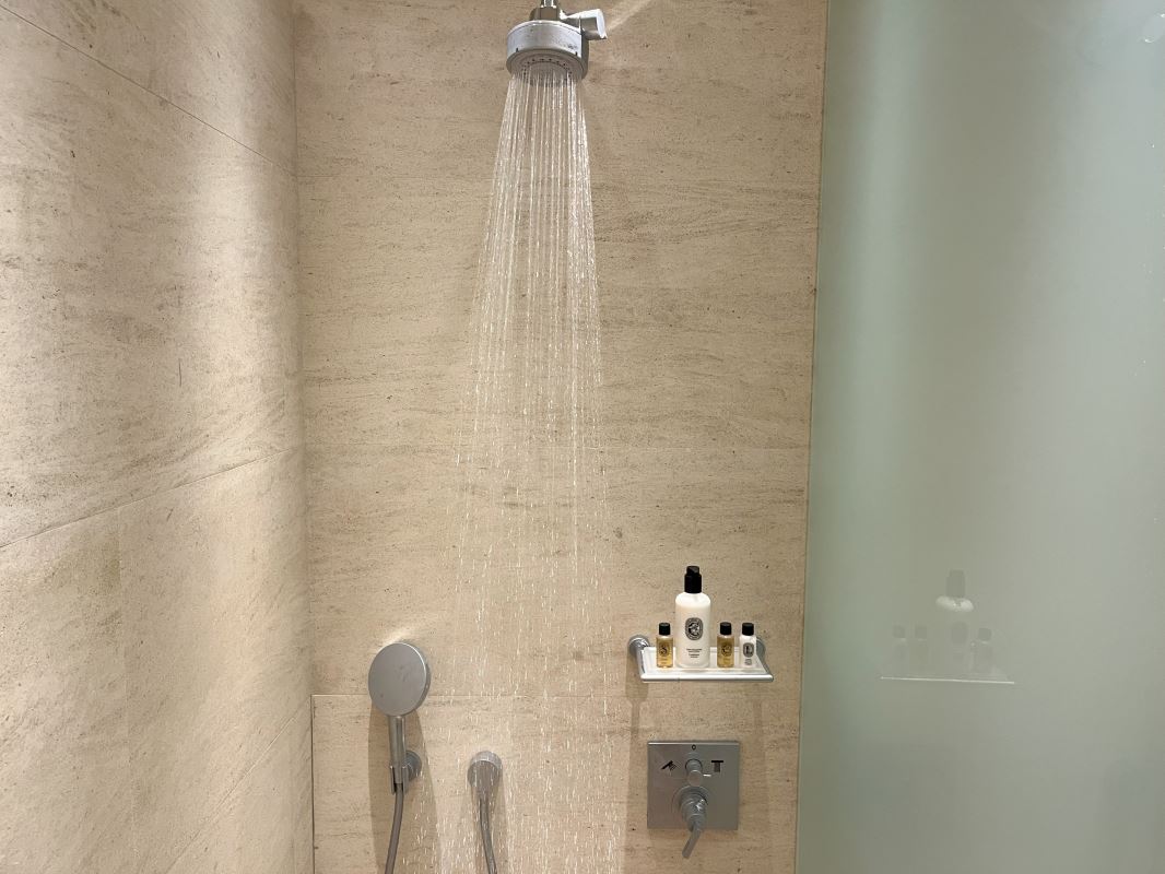 a shower head with water coming out of it
