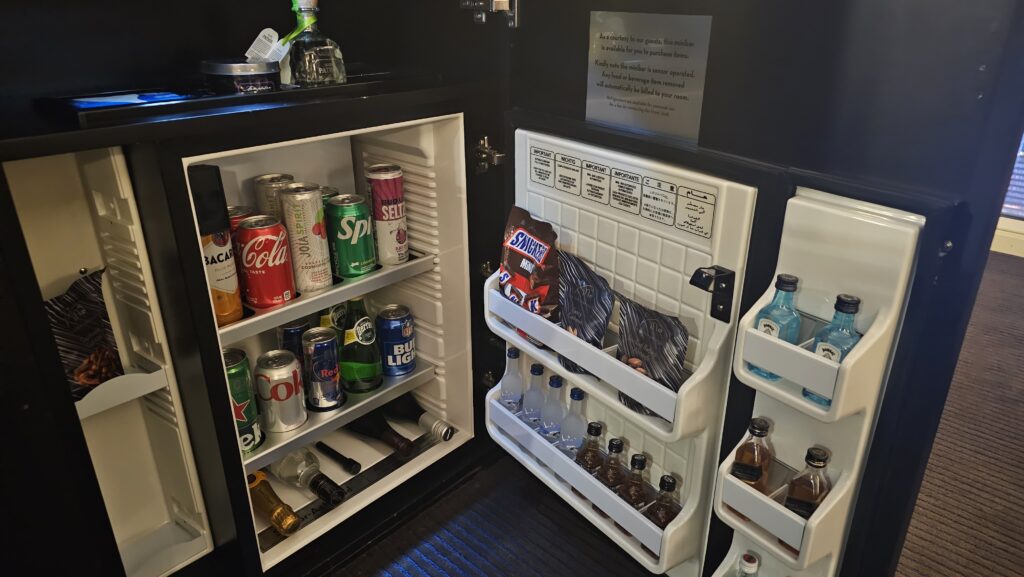 a mini fridge with drinks and snacks