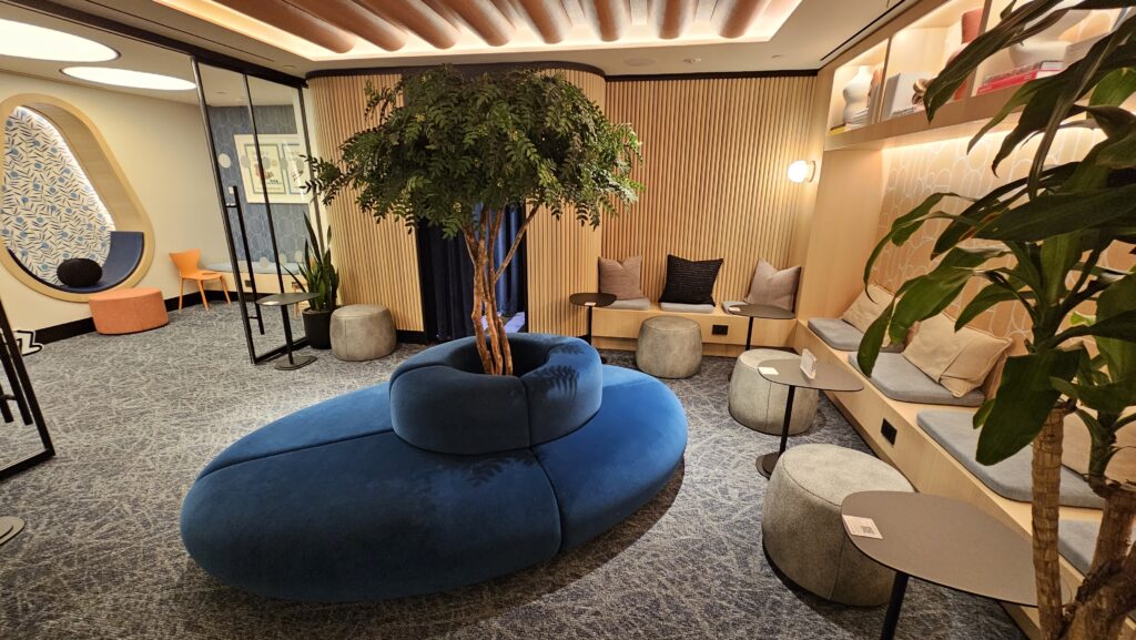 a blue couch with a tree in it