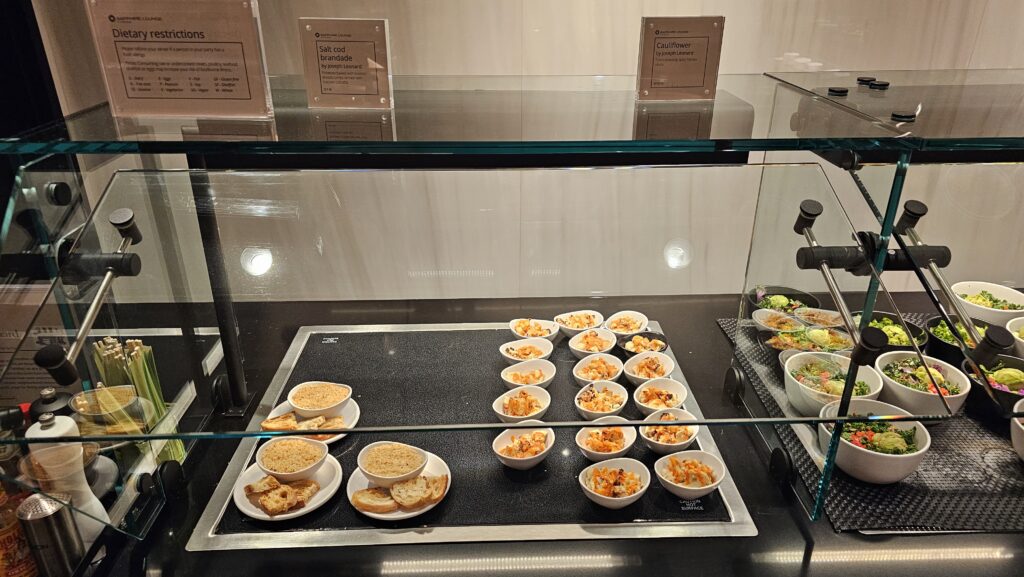 a display case with food on plates