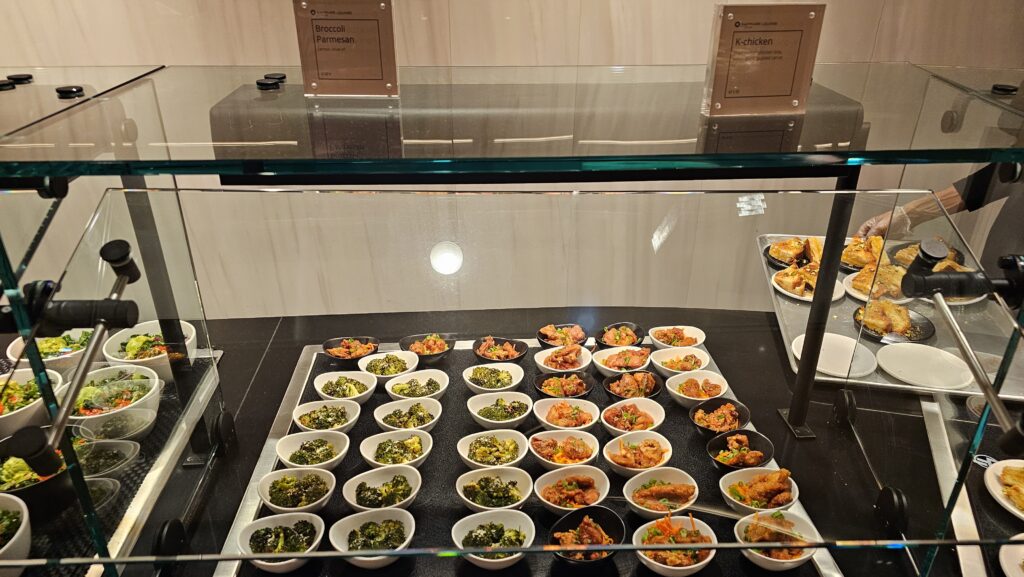 a display case with food in bowls