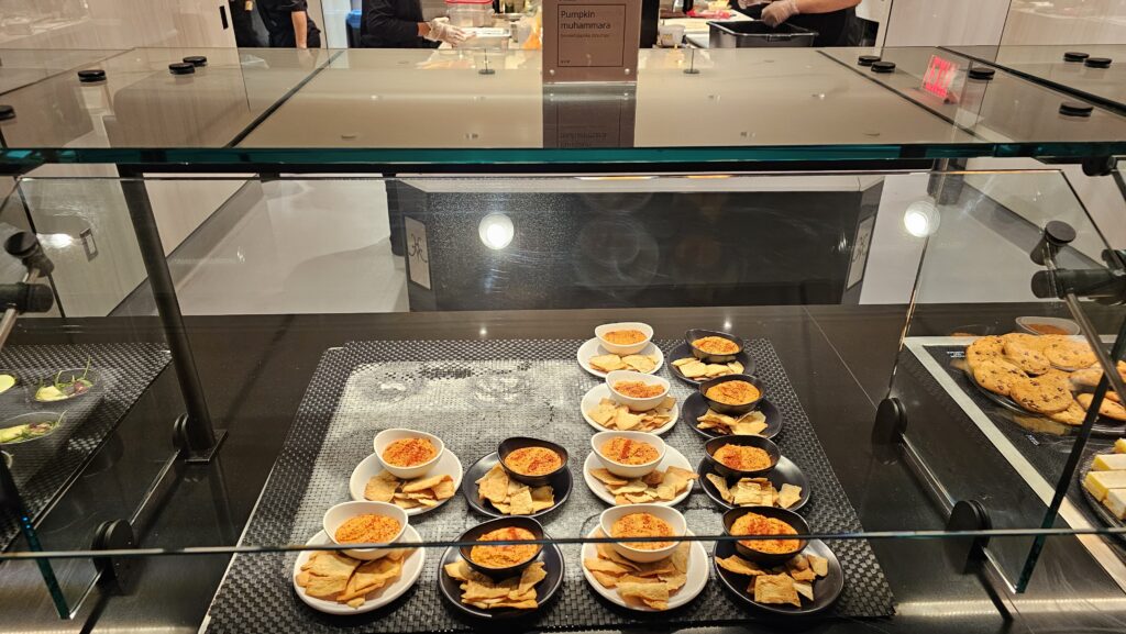 a group of plates of food in a glass case