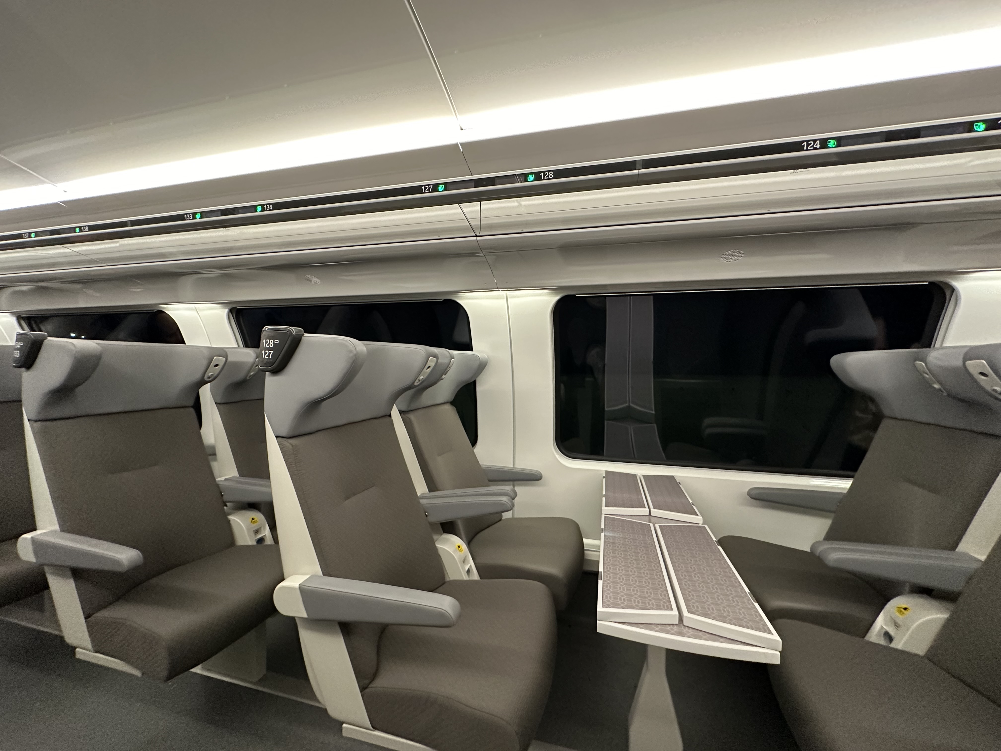 a train with seats and a table