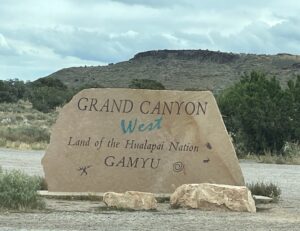 a large stone sign in the desert