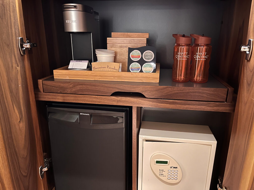 a small refrigerator with a small refrigerator and a coffee maker