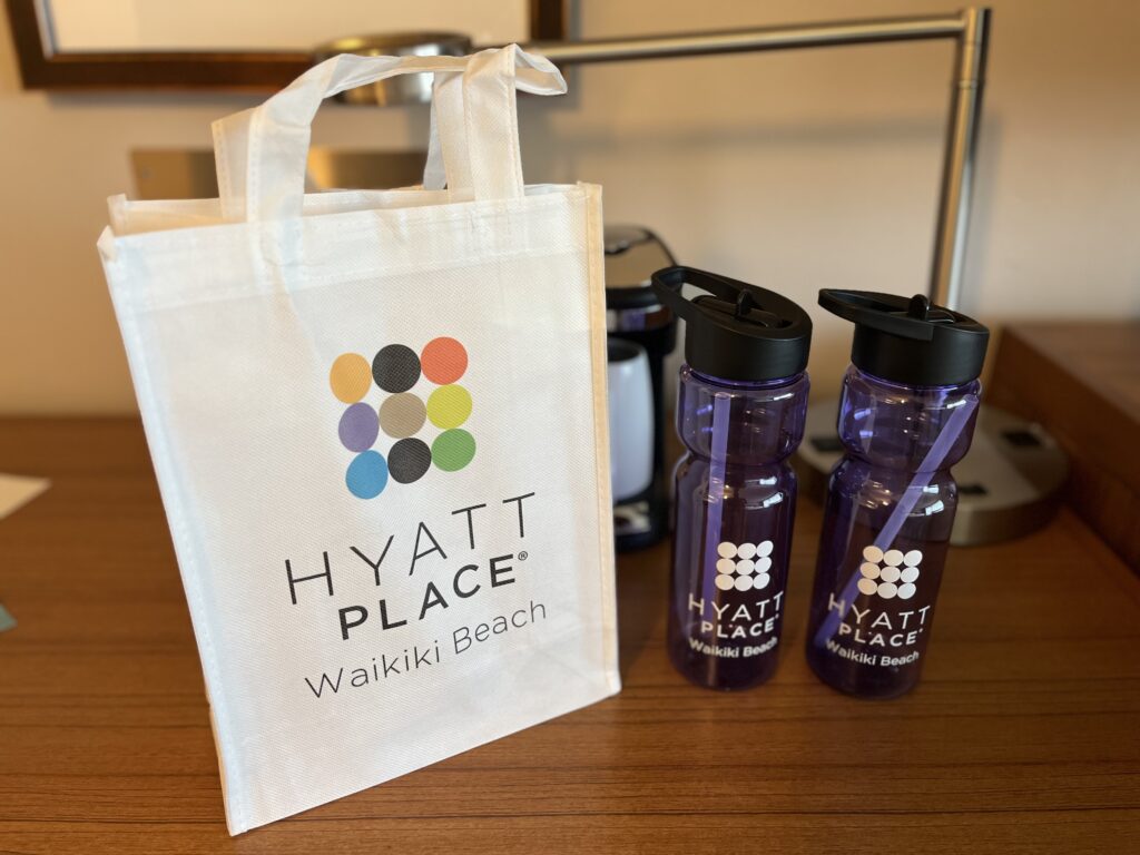 a bag and water bottles on a table