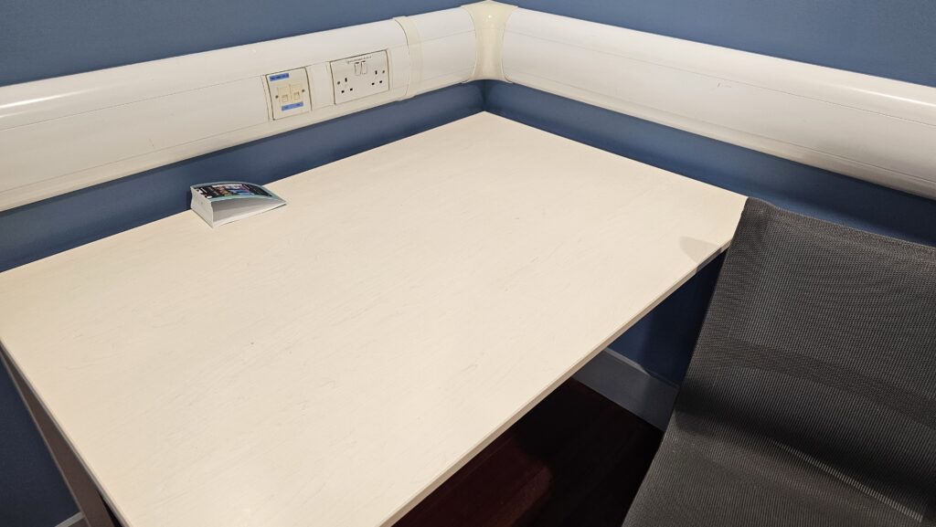 a white table with a phone on it