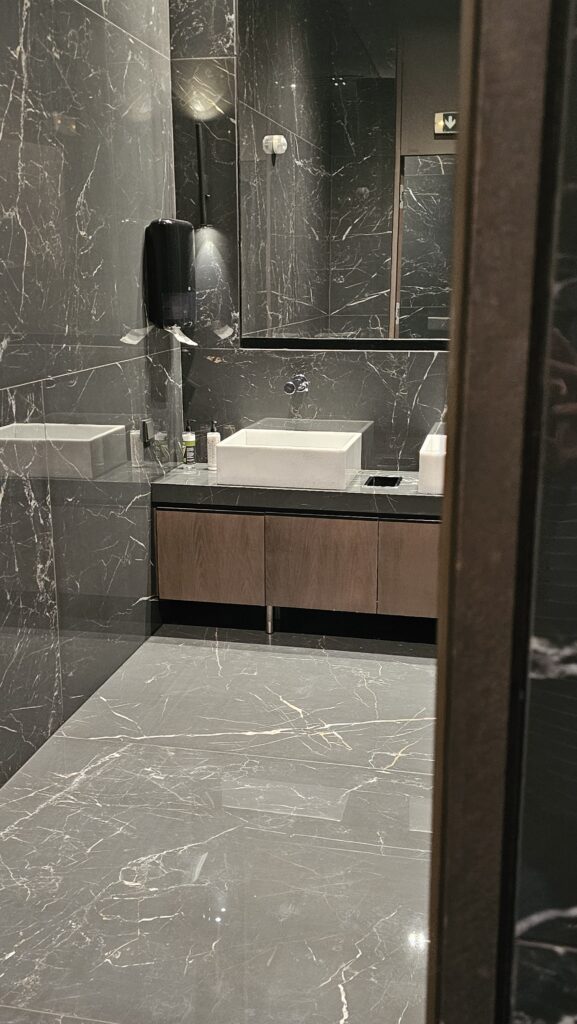 a bathroom with marble tiles