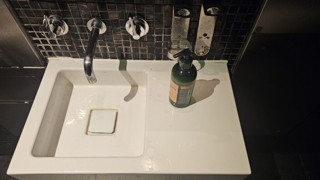 a soap dispenser on a sink